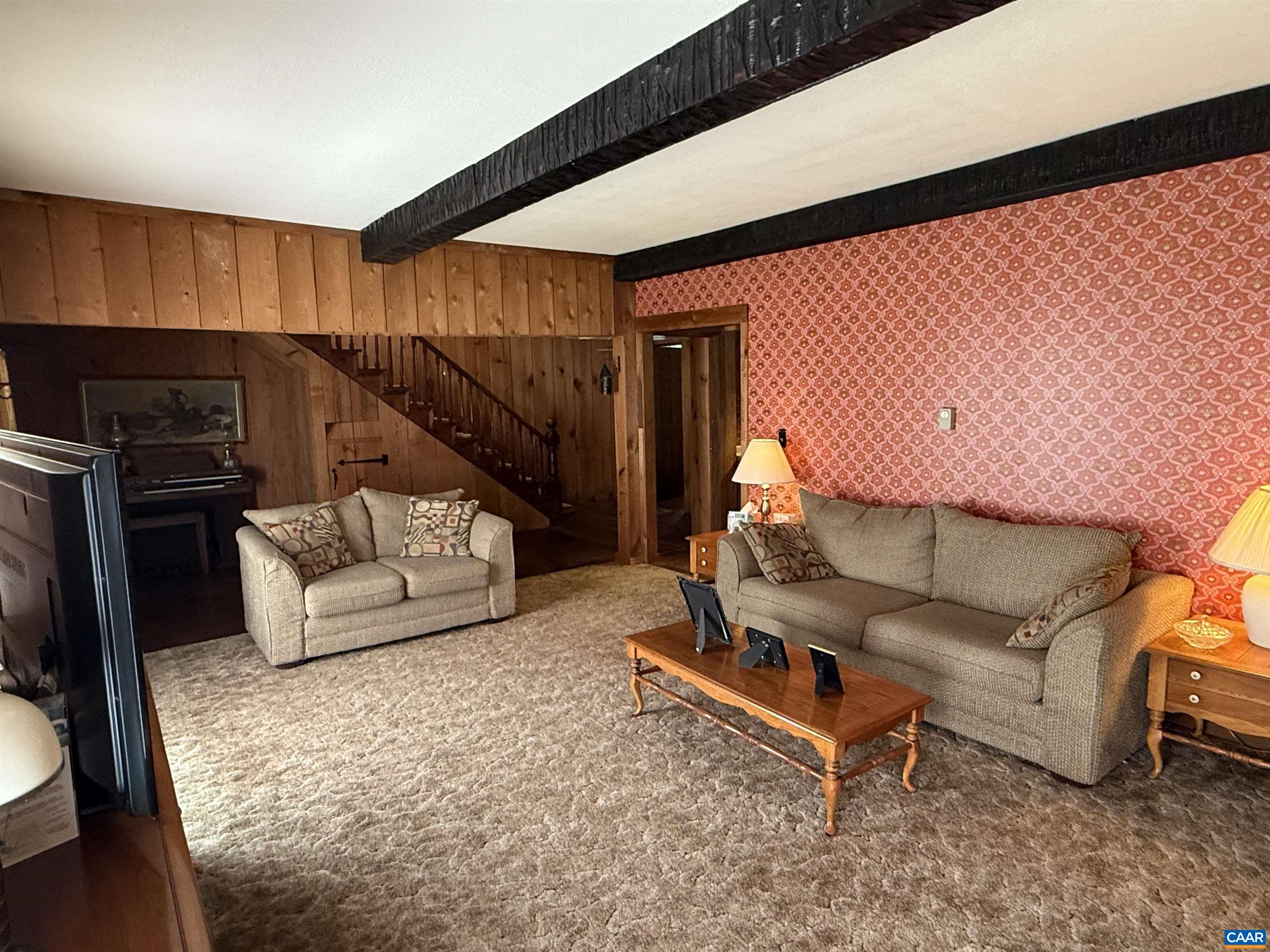5609 New Line Road Gum Spring, VA 23065 - Photo 6 of 61 a living room with furniture and a flat screen tv