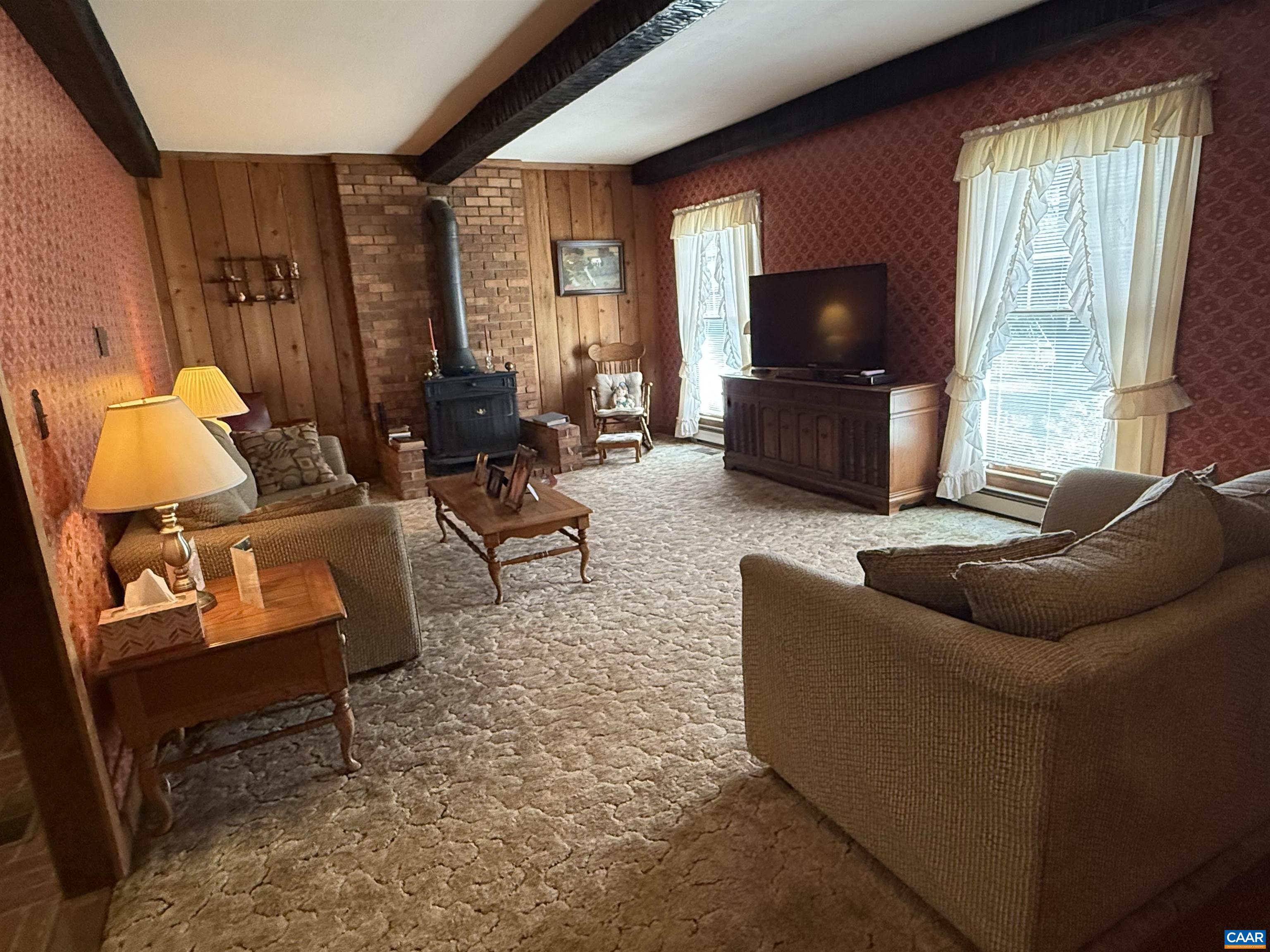 5609 New Line Road Gum Spring, VA 23065 - Photo 7 of 61 a living room with furniture and a flat screen tv