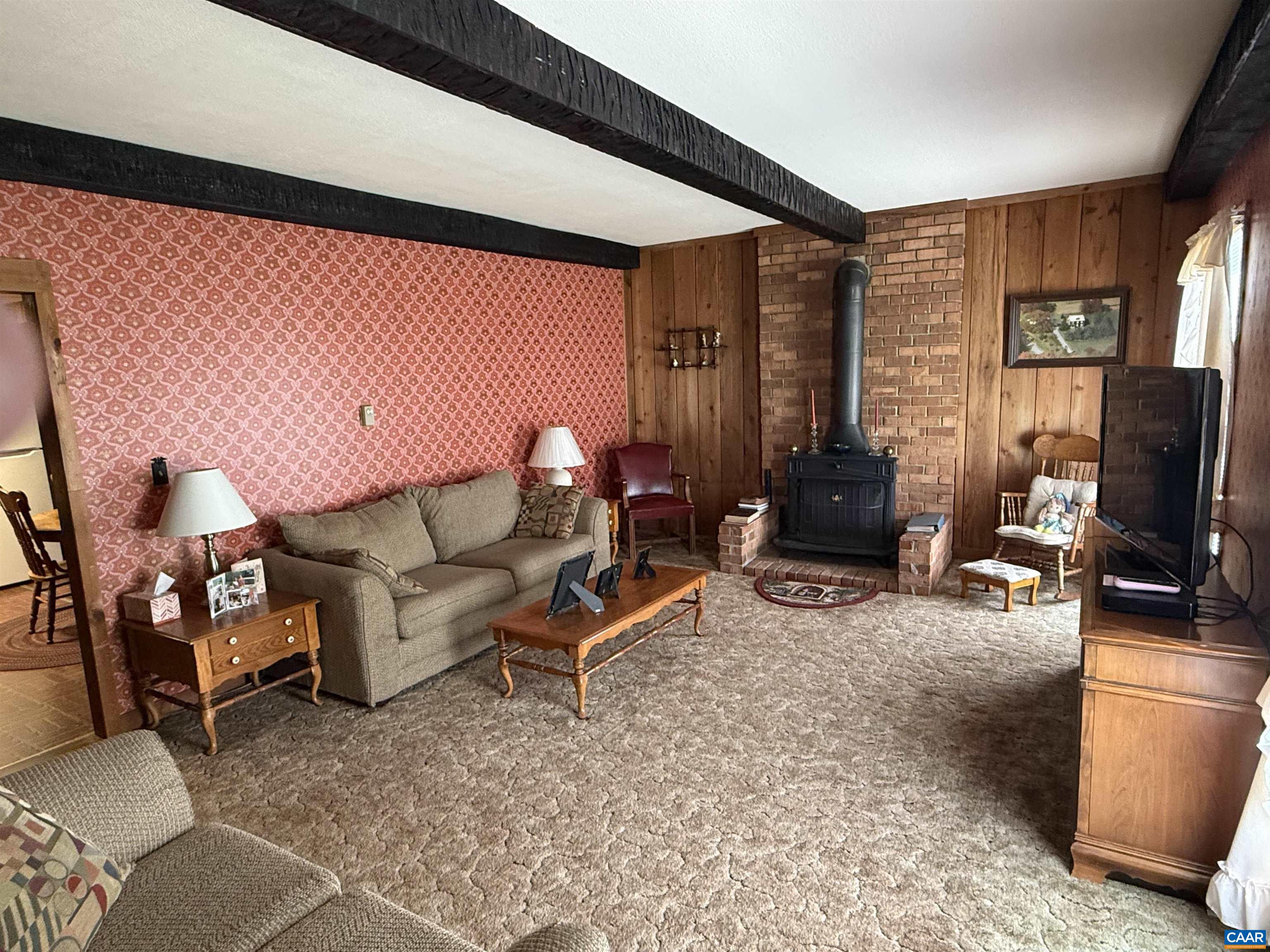 5609 New Line Road Gum Spring, VA 23065 - Photo 8 of 61 a living room with furniture a flat screen tv and a large window