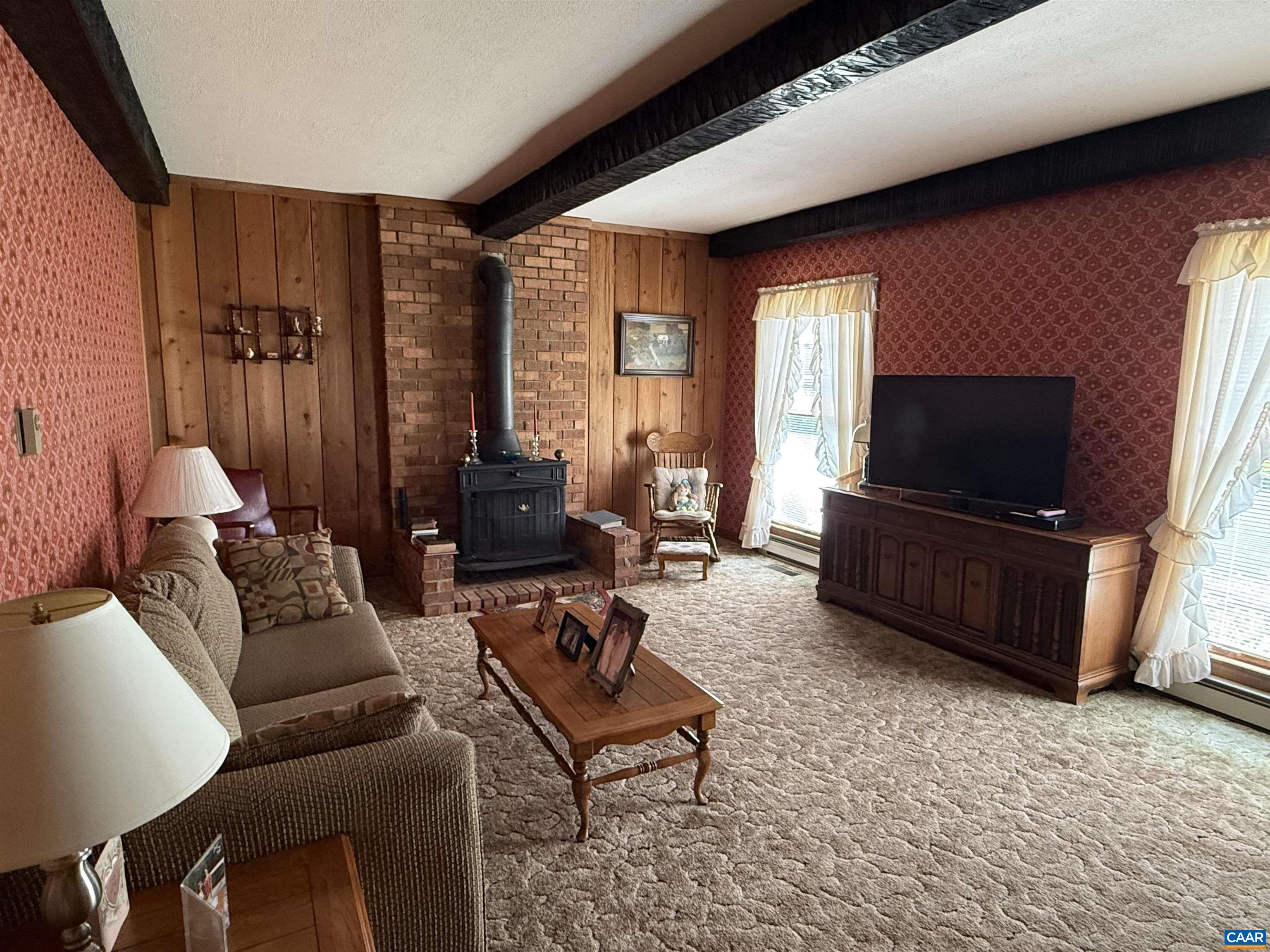 5609 New Line Road Gum Spring, VA 23065 - Photo 9 of 61 a living room with furniture and a flat screen tv