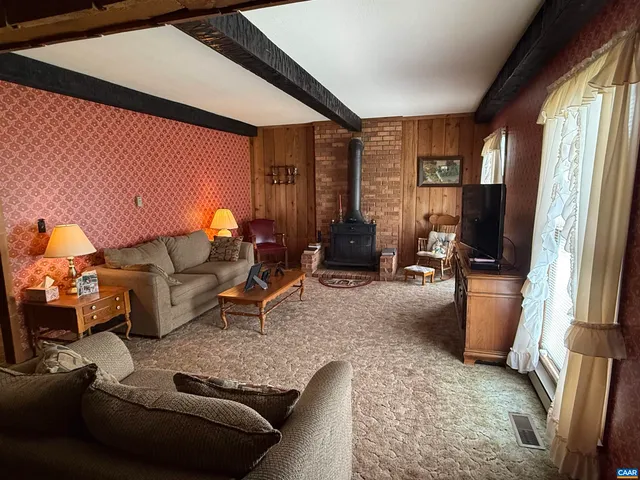 a dining table with chairs and window