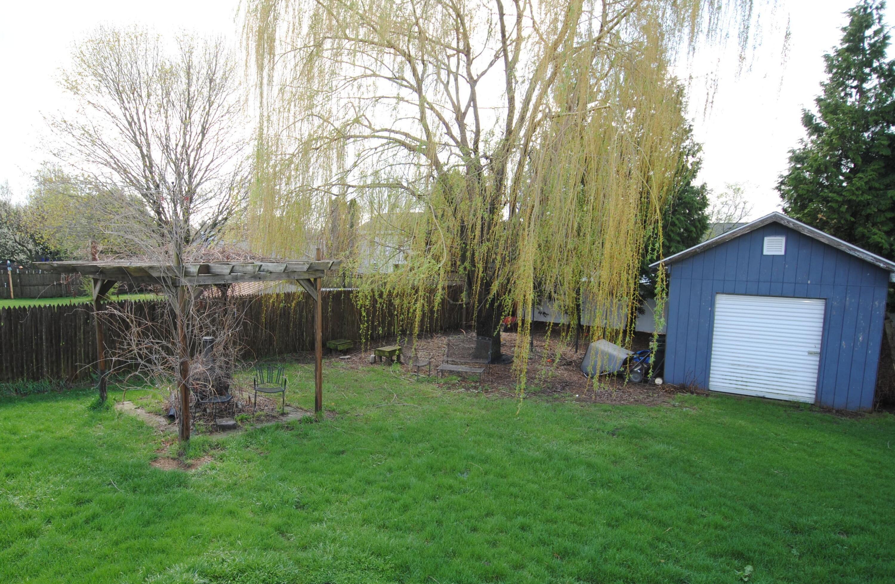 304 Aspen Court Delavan, WI 53115 - Photo 17 of 35 Backyard_Shed, Pergola, Nearly Half Acre