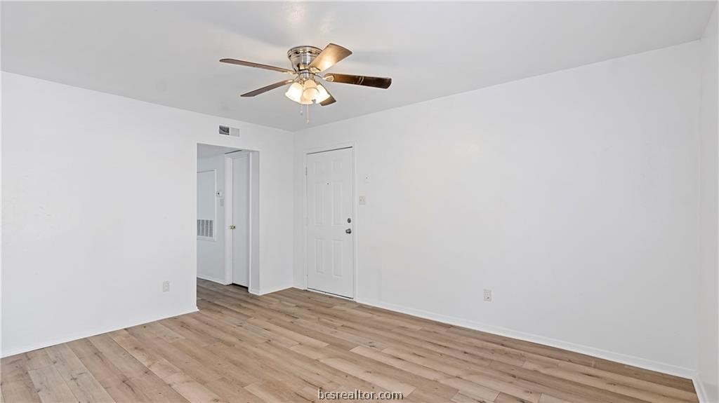 2712 Evergreen Circle Bryan, TX 77801 - Photo 10 of 30 Unfurnished room with ceiling fan and light hardwood / wood-style floors