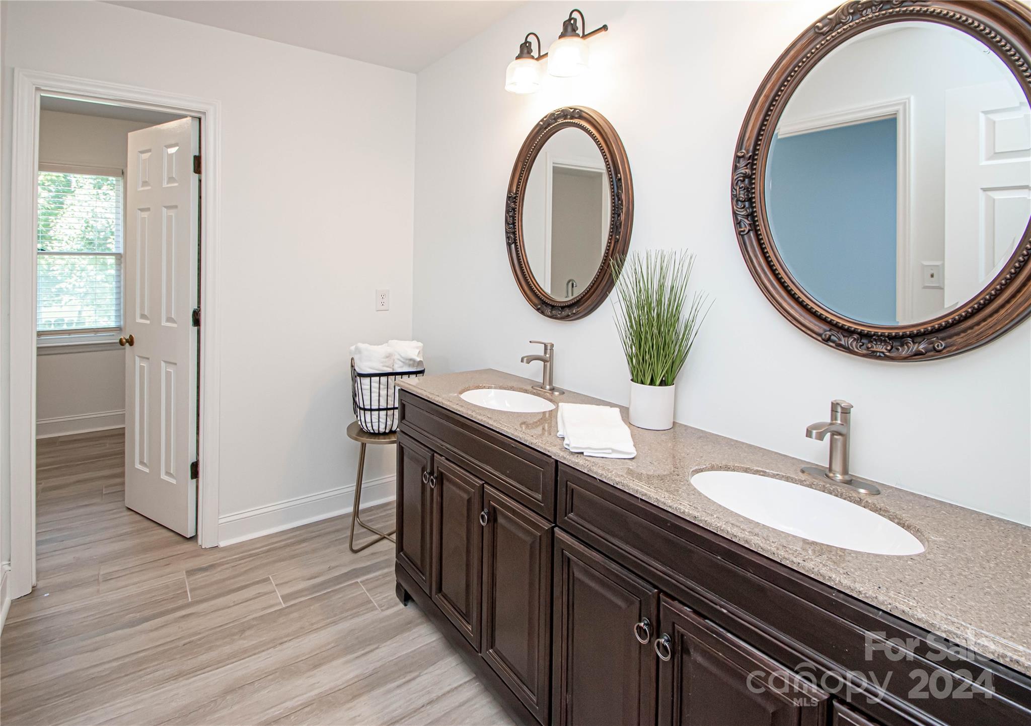 6325 Dovefield Road Charlotte, NC 28277 - Photo 34 of 48 a bathroom with a granite countertop double vanity sinks and a mirror