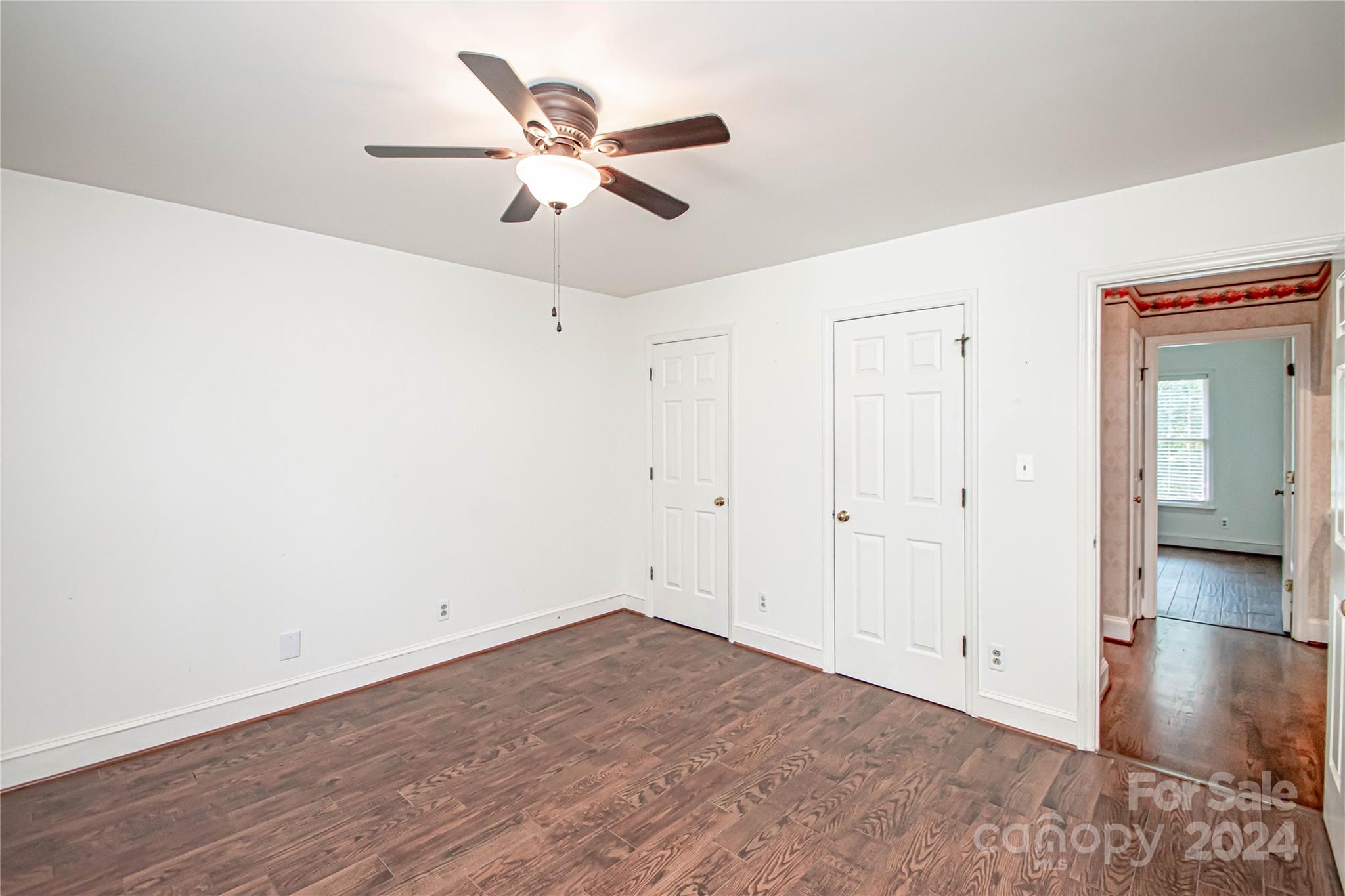 6325 Dovefield Road Charlotte, NC 28277 - Photo 39 of 48 an empty room with wooden floor and windows