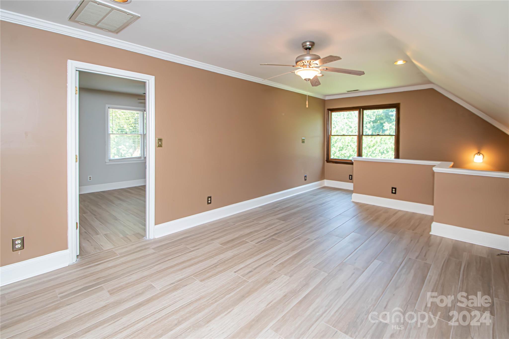 6325 Dovefield Road Charlotte, NC 28277 - Photo 43 of 48 wooden floor in an empty room with a window