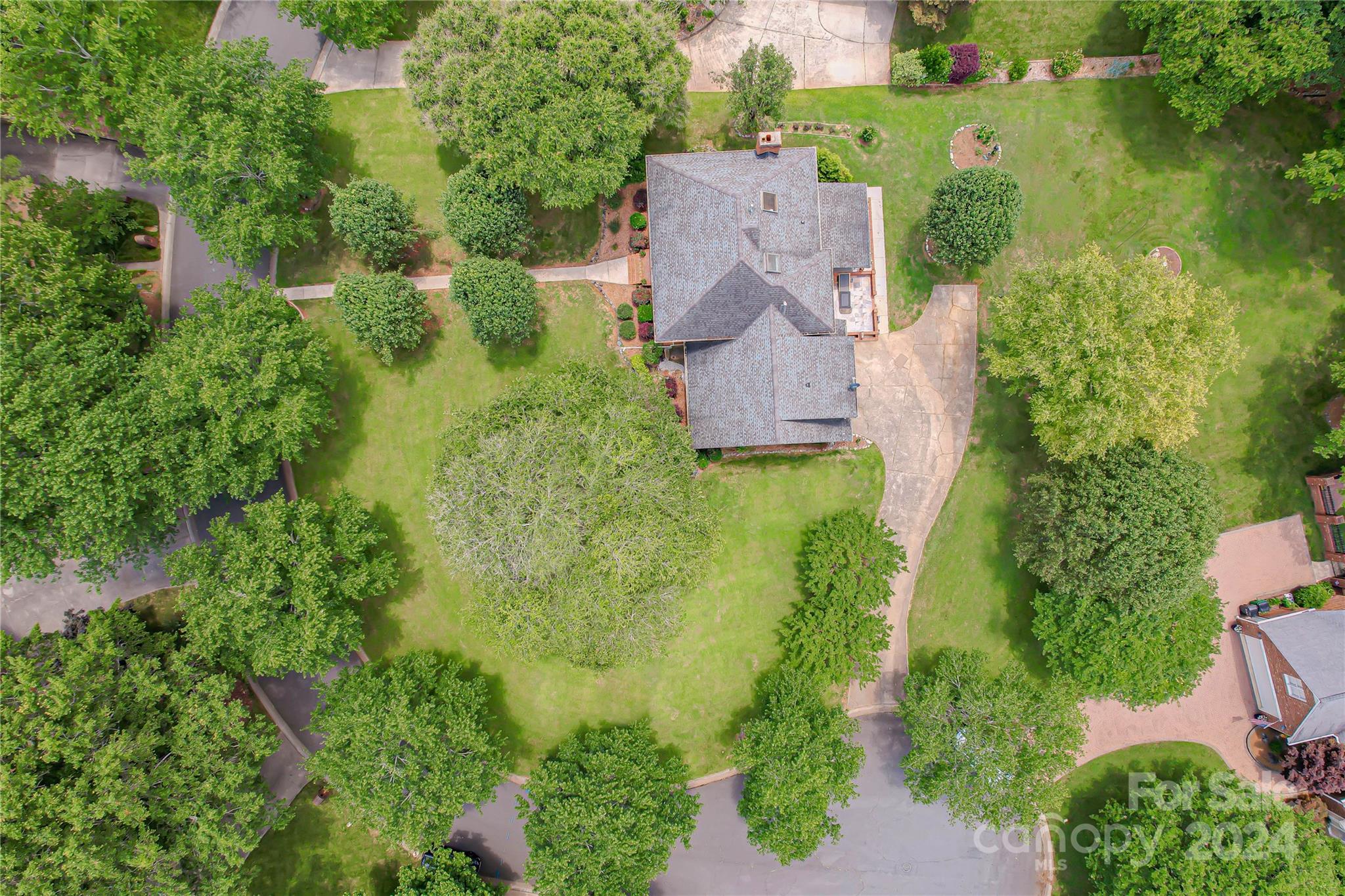 6325 Dovefield Road Charlotte, NC 28277 - Photo 6 of 48 an aerial view of residential house with outdoor space and trees all around