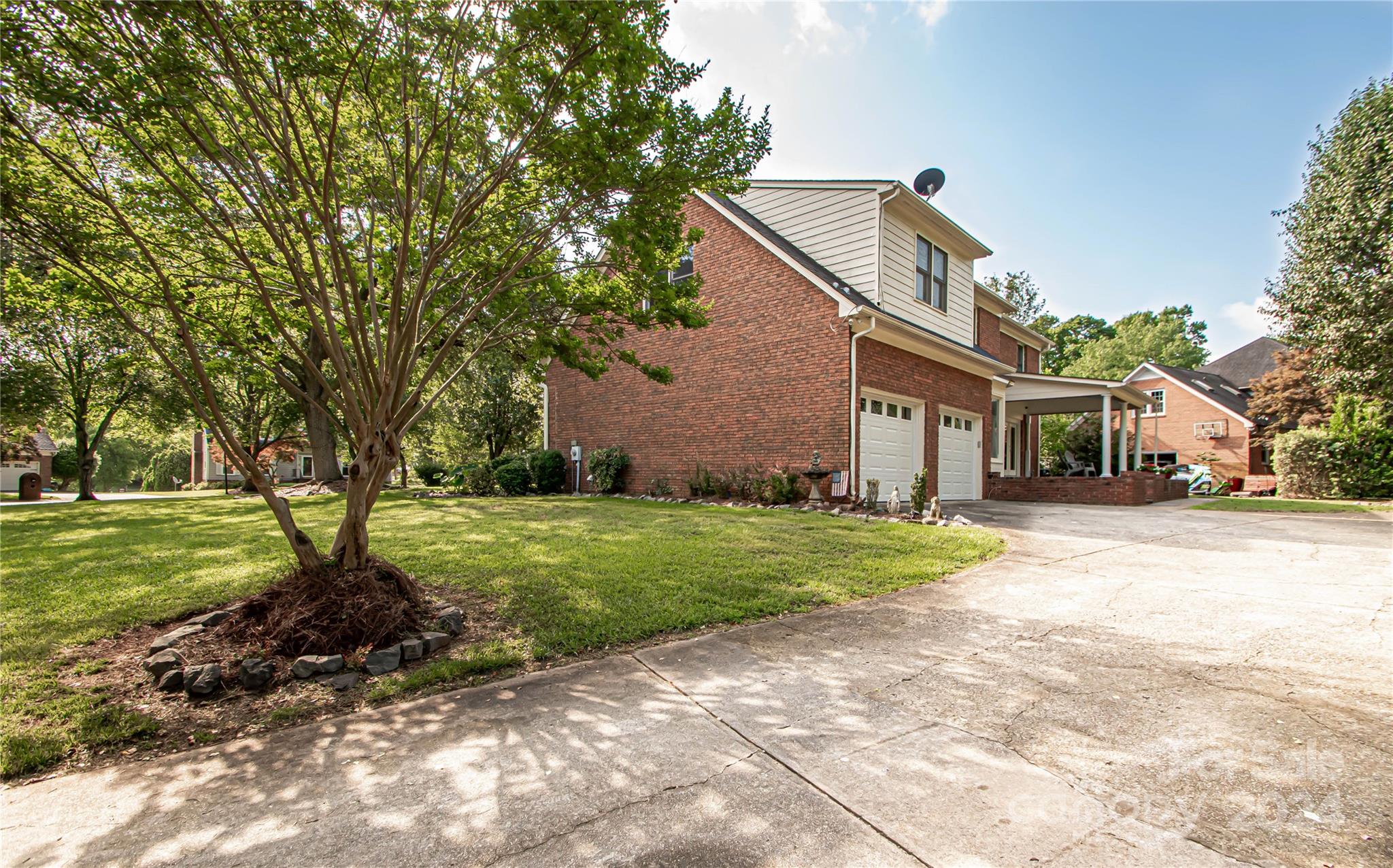 6325 Dovefield Road Charlotte, NC 28277 - Photo 8 of 48 a front view of a house with a yard and trees