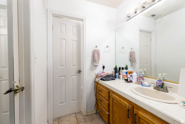 3707 Gates Circle Santa Clara, UT 84765 - Photo 14 of 19 Bathroom with vanity and light tile patterned floors