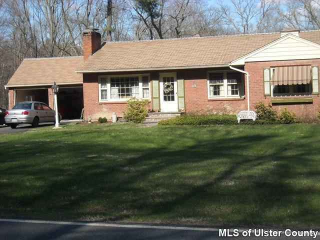 3890 Atwood Road Stone Ridge, NY 12484 - Photo 1 of 1 a front view of a house with a garden