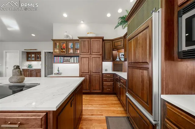 a hallway with sink and wooden floor