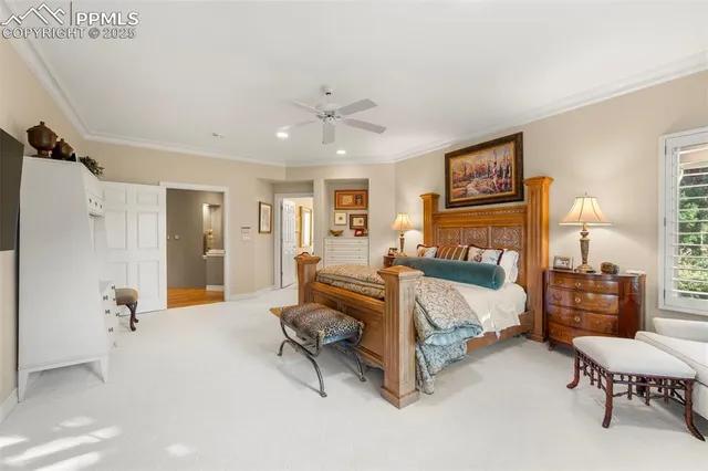 a large white kitchen with a large window