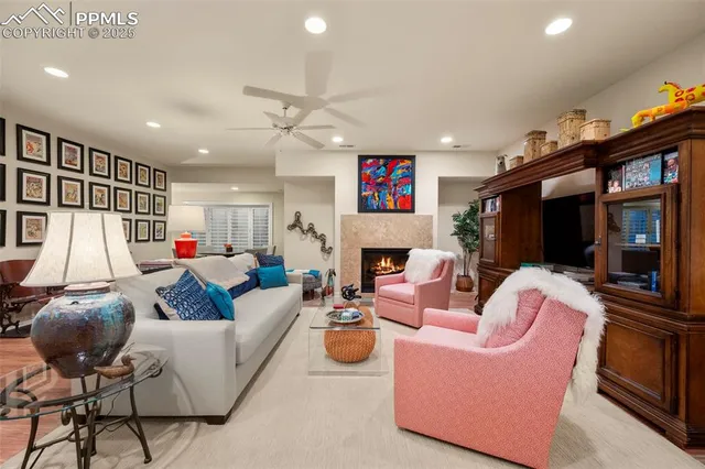 a living room with lots of furniture and kitchen view