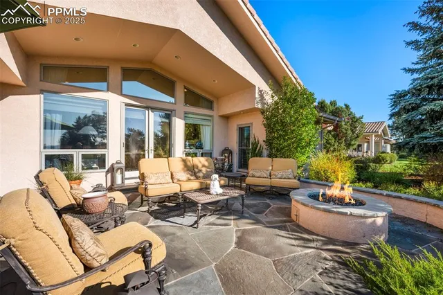 a aerial view of a house with garden space and a street view