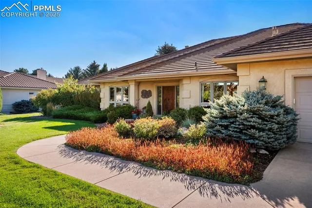 a view of a livingroom with wooden floor and furniture