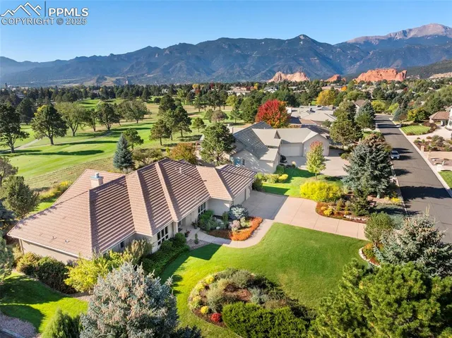 a balcony with wooden floor and outdoor seating