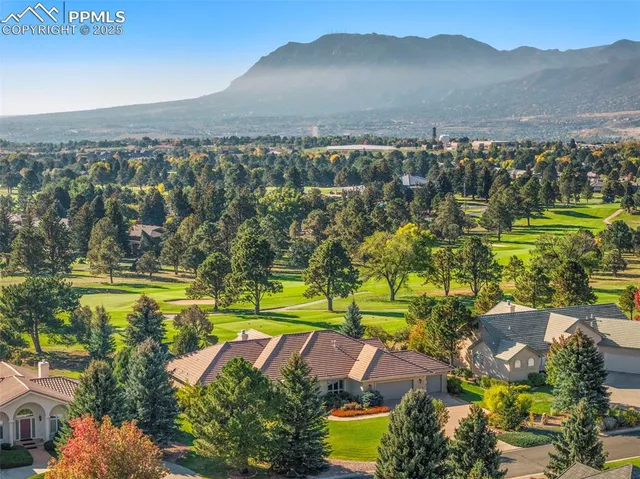 a view of a patio with dining table and chairs with a fire pit