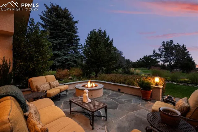 a view of a house with swimming pool and a garden