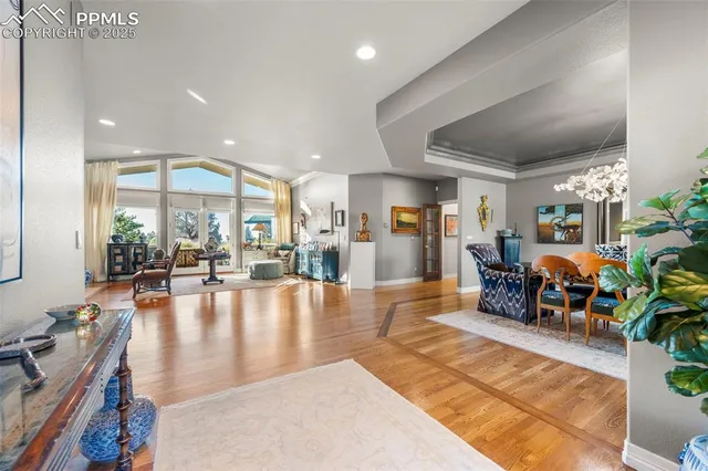 a view of a dining room with furniture and chandelier