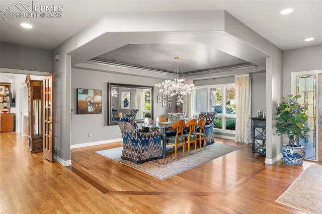 a living room with fireplace furniture and a large window