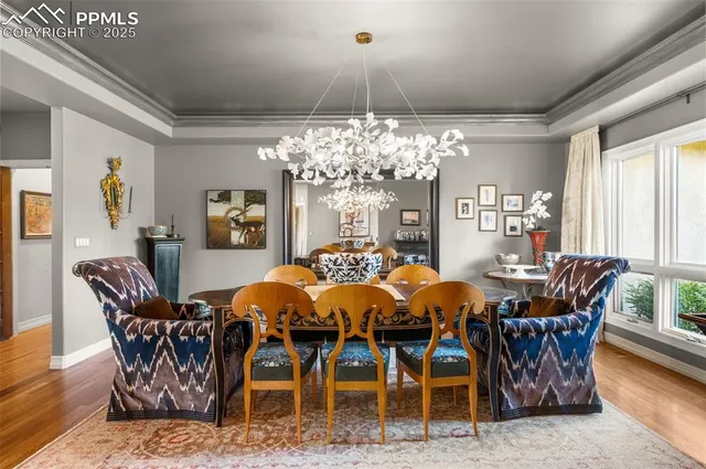 a living room with fireplace furniture and a large window