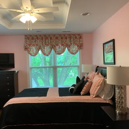 a bedroom with a bed window and a bed