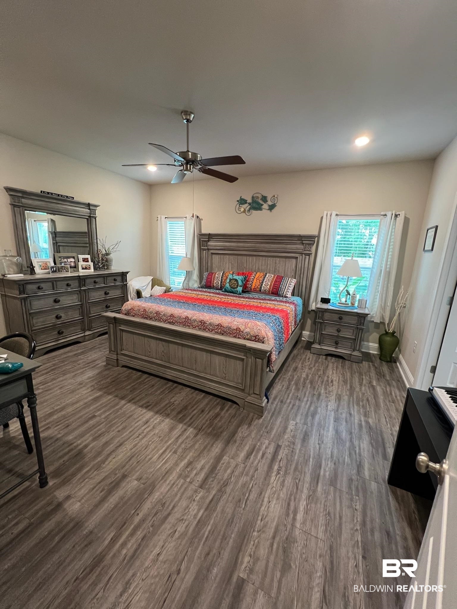 3904 Conrad Court Gulf Shores, AL 36542 - Photo 14 of 24 Bedroom with dark hardwood / wood-style floors and ceiling fan