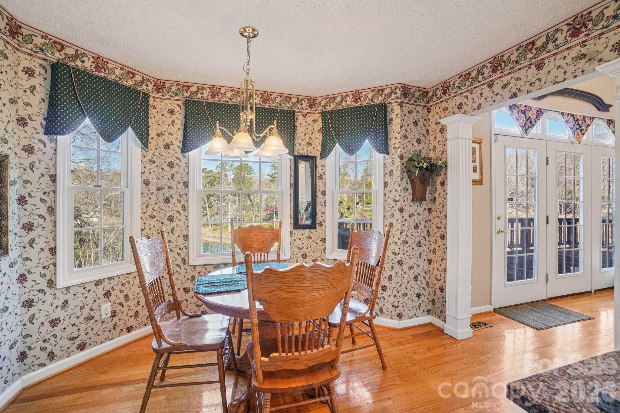4634 Harbor View Terrace Morganton, NC 28655 - Photo 21 of 39 a view of a dining room with furniture window and wooden floor