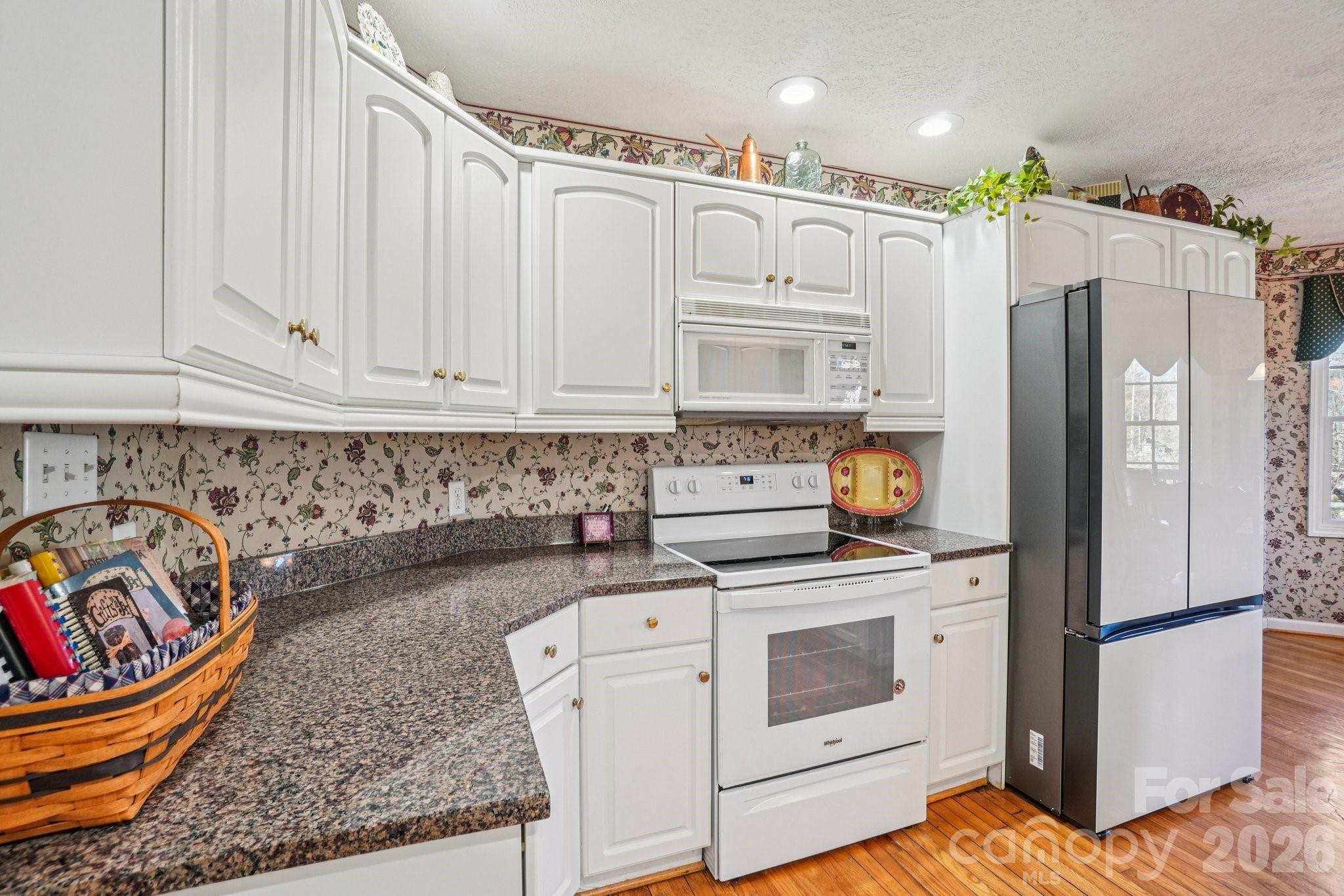 4634 Harbor View Terrace Morganton, NC 28655 - Photo 26 of 39 a kitchen with stainless steel appliances granite countertop a refrigerator sink and stove