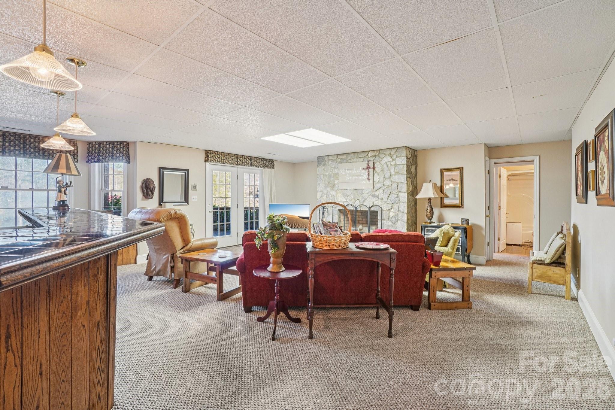 4634 Harbor View Terrace Morganton, NC 28655 - Photo 30 of 39 a living room with furniture a large window and a chandelier
