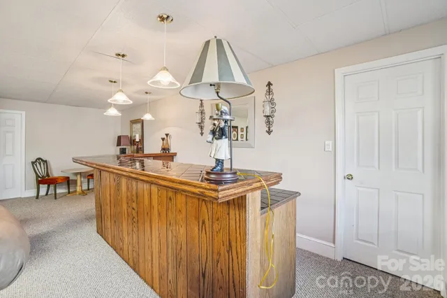 a view of a living room and chandelier