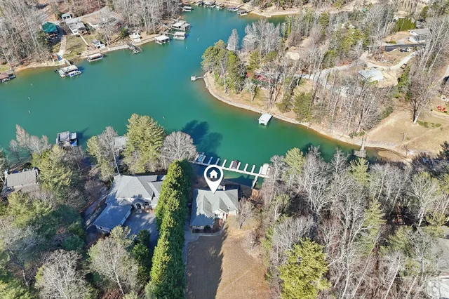 a view of a house with a yard and garden