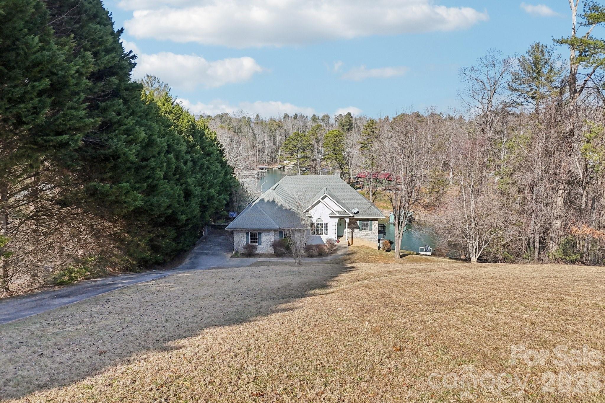 4634 Harbor View Terrace Morganton, NC 28655 - Photo 5 of 39 a view of a house with a yard and large trees
