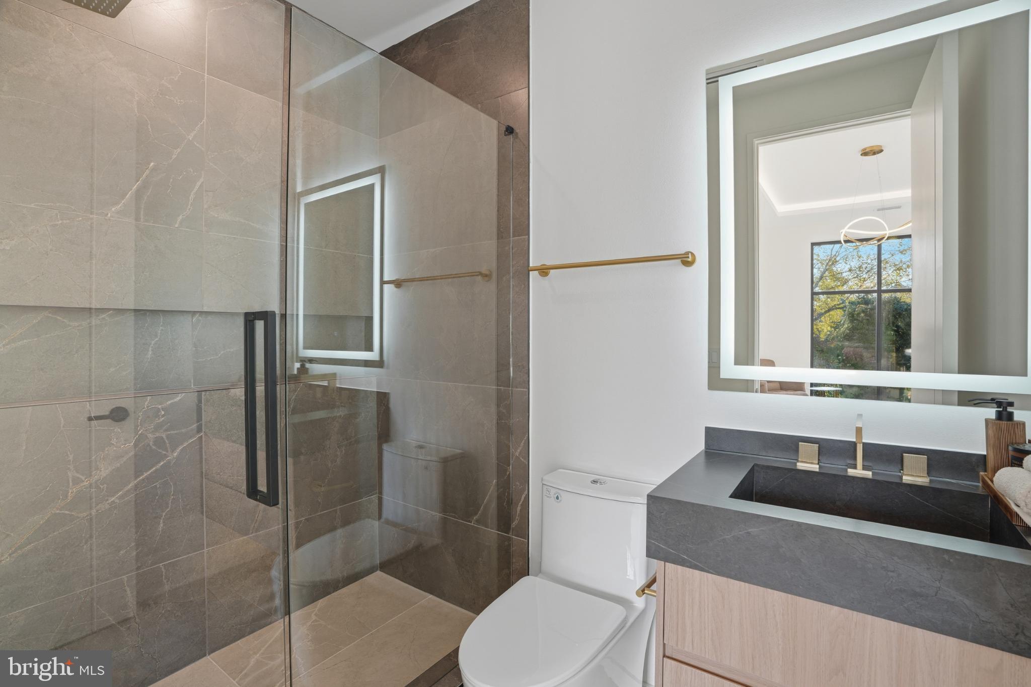 9408 Old Courthouse Road Vienna, VA 22182 - Photo 62 of 92 Sleek modern bathroom with elegant finishes.
