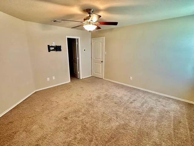 a view of a big room with carpet