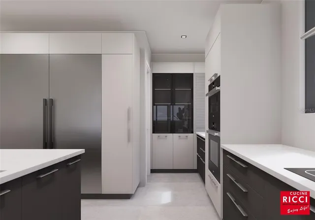 a kitchen with a refrigerator and a sink