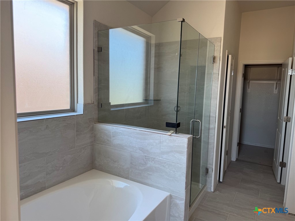 7110 Touchstone Drive Temple, TX 76502 - Photo 7 of 9 a bathroom with a shower and a tub