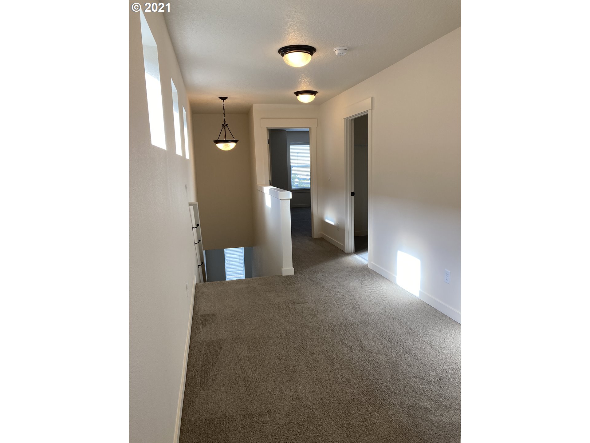7113 South 11th Street Ridgefield, WA 98642 - Photo 6 of 7 a view of a hallway with wooden shelves