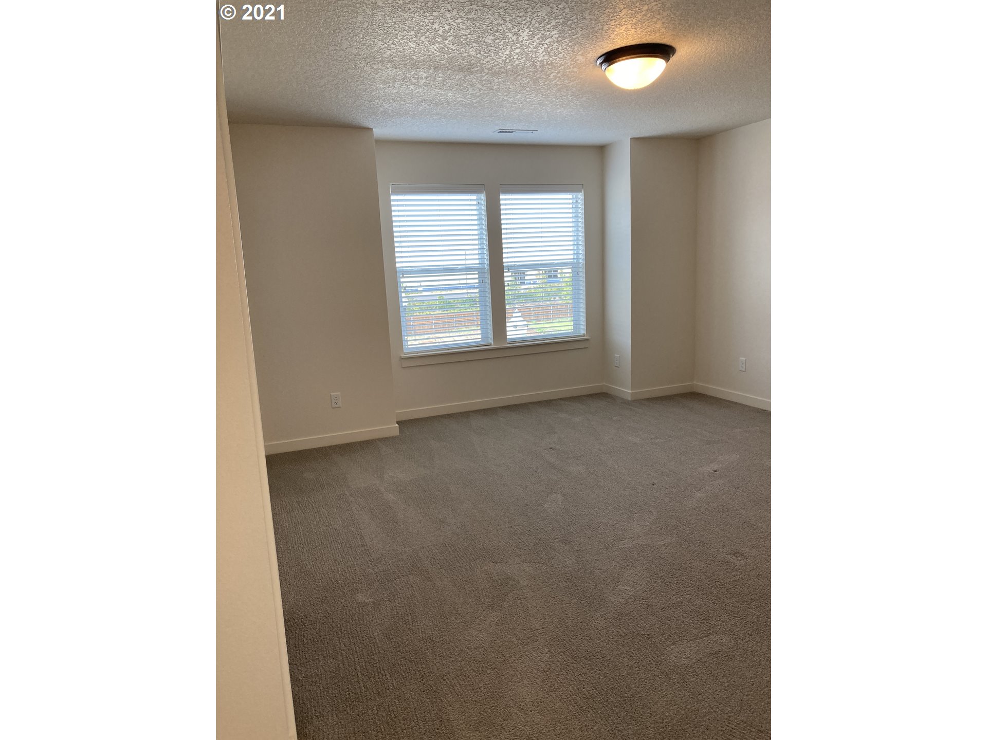 7113 South 11th Street Ridgefield, WA 98642 - Photo 7 of 7 a view of an empty room with a window