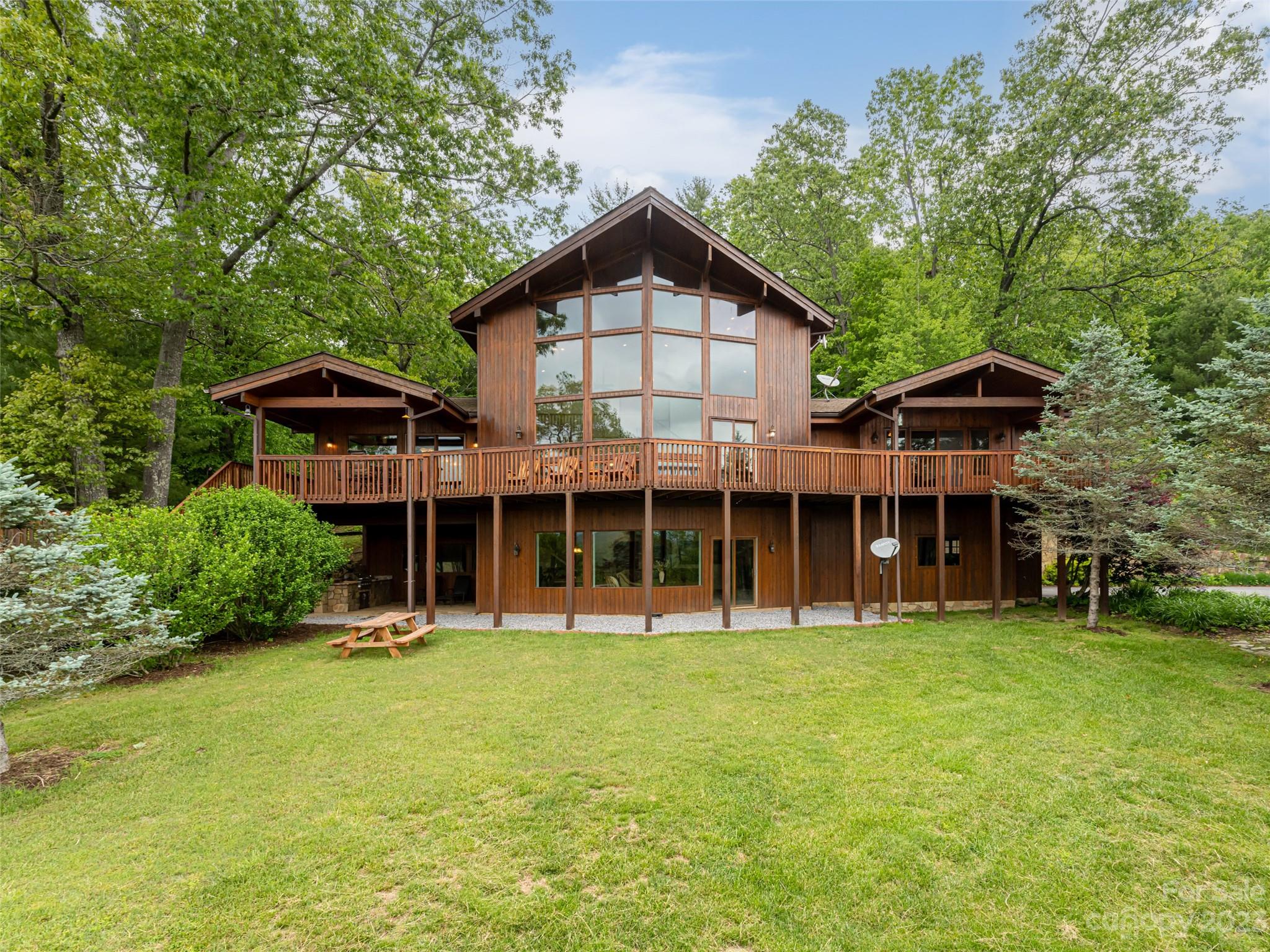 323 Lucky Lane Clyde, NC 28721 - Photo 11 of 48 a front view of a house with a yard