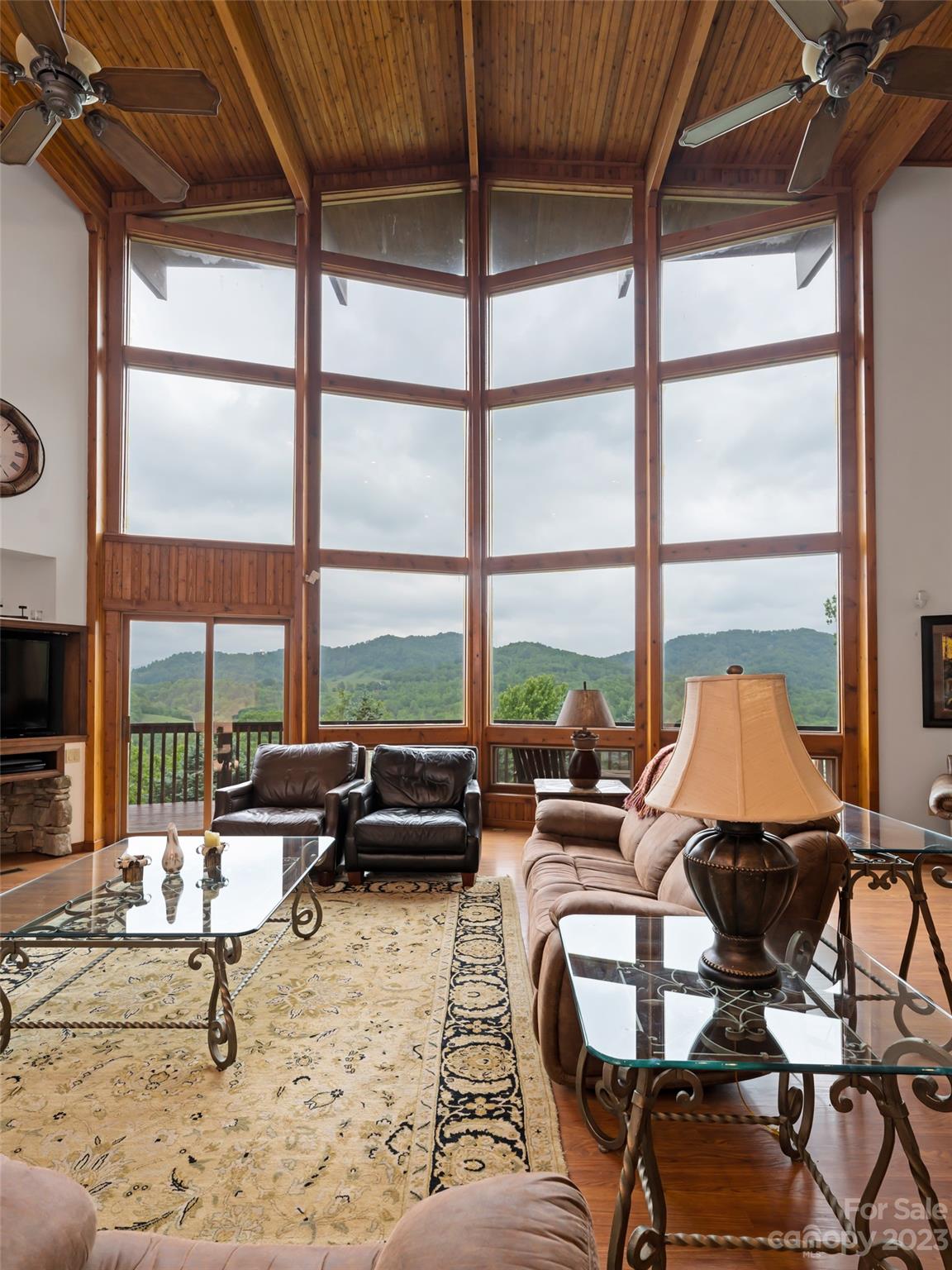 323 Lucky Lane Clyde, NC 28721 - Photo 16 of 48 a living room with furniture and a large window