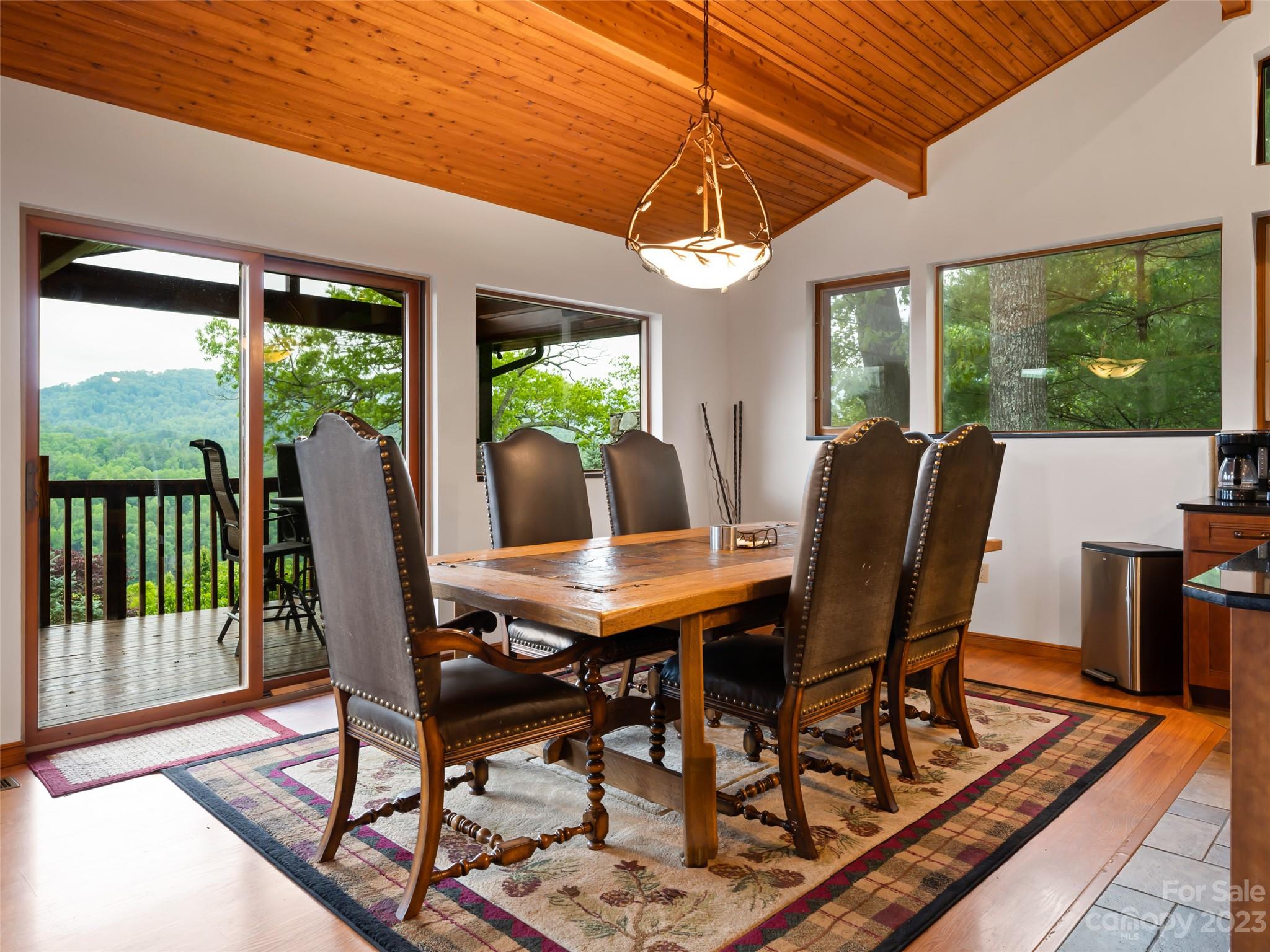 323 Lucky Lane Clyde, NC 28721 - Photo 19 of 48 a view of a dining room with furniture window and outside view