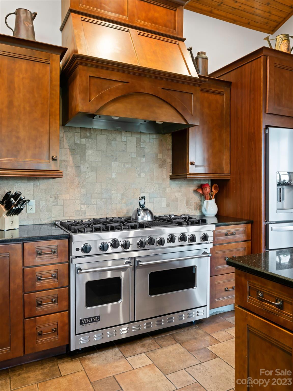 323 Lucky Lane Clyde, NC 28721 - Photo 26 of 48 a kitchen with stainless steel appliances granite countertop a stove and a microwave