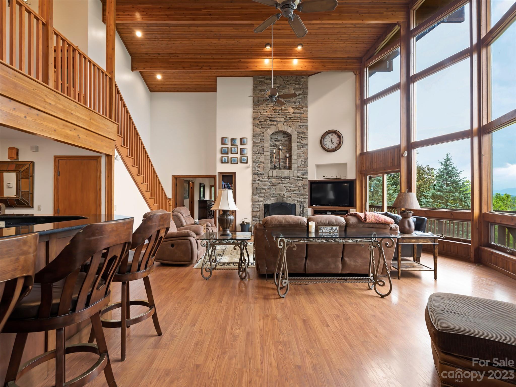 323 Lucky Lane Clyde, NC 28721 - Photo 27 of 48 a living room with furniture and a large window