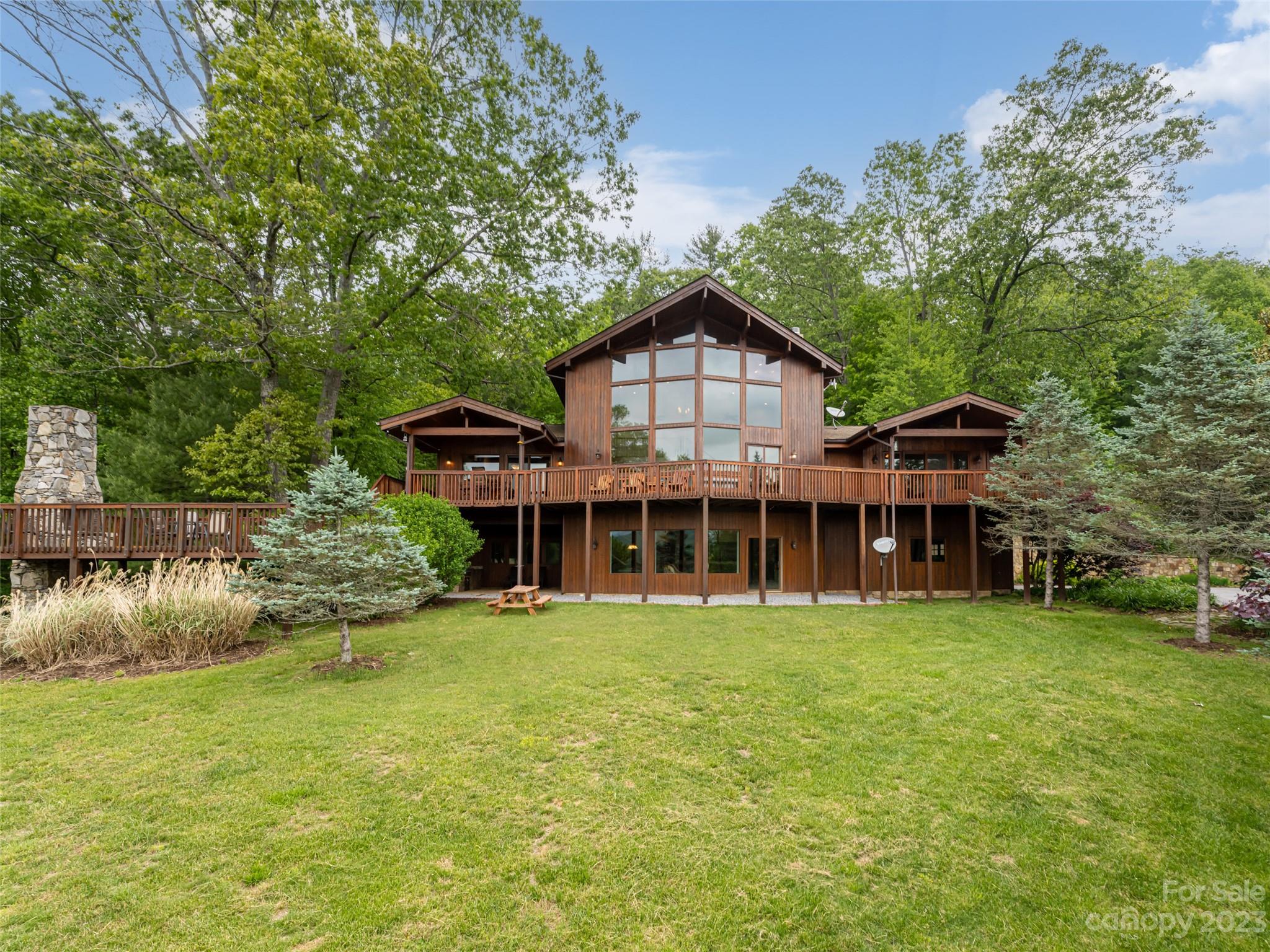 323 Lucky Lane Clyde, NC 28721 - Photo 39 of 48 a view of a house with a yard and sitting area
