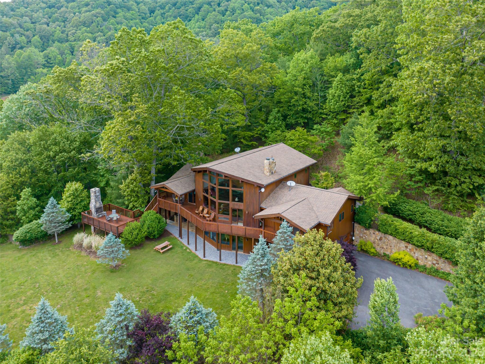 323 Lucky Lane Clyde, NC 28721 - Photo 45 of 48 an aerial view of a house with a big yard