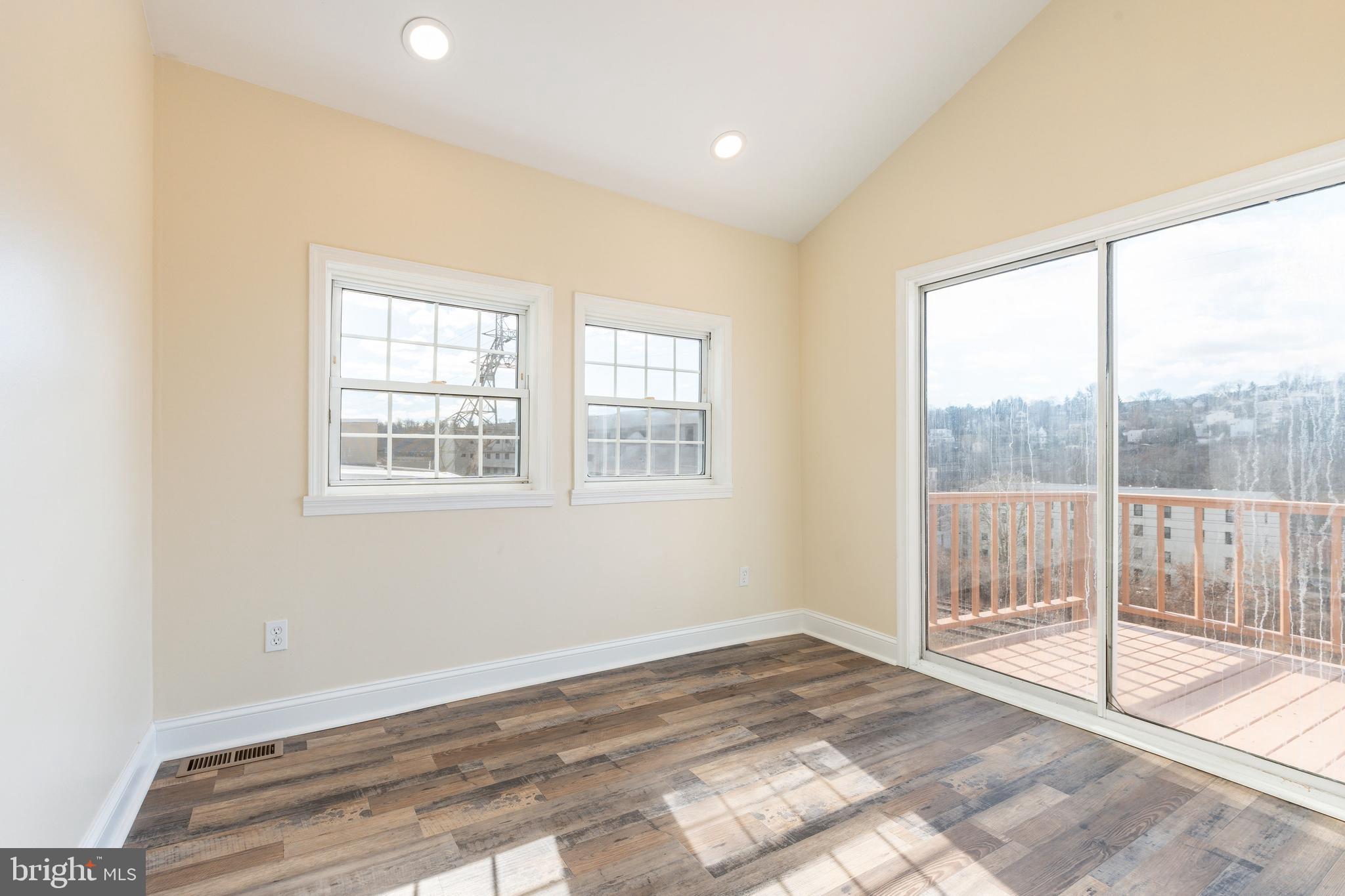 4664 Canton Street Philadelphia, PA 19127 - Photo 17 of 32 a view of a room with wooden floor and next to a window