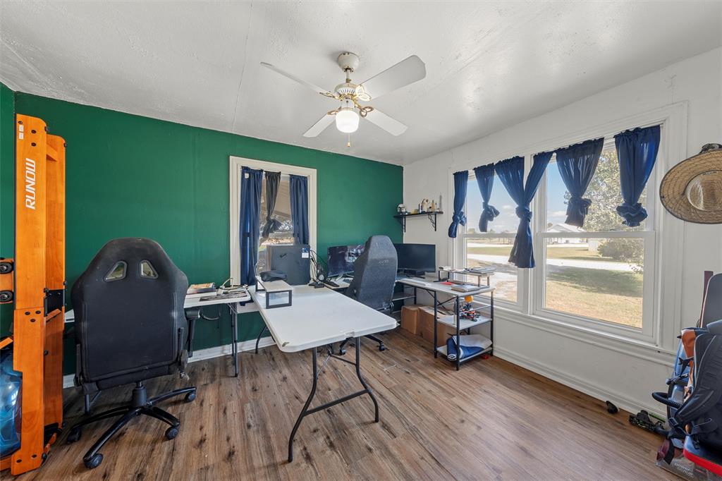 143 Crawford Mount Calm, TX 76673 - Photo 12 of 19 a view of a workspace with furniture and a window