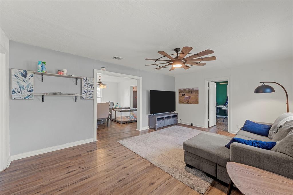 143 Crawford Mount Calm, TX 76673 - Photo 2 of 19 a living room with furniture and a flat screen tv