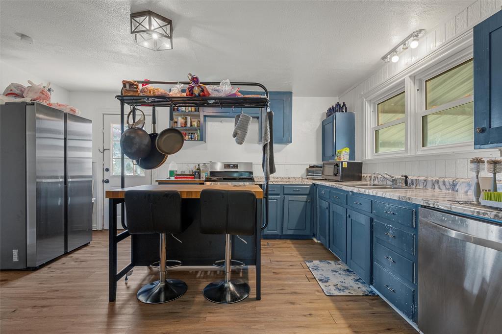 143 Crawford Mount Calm, TX 76673 - Photo 7 of 19 a kitchen with a table and chairs in it